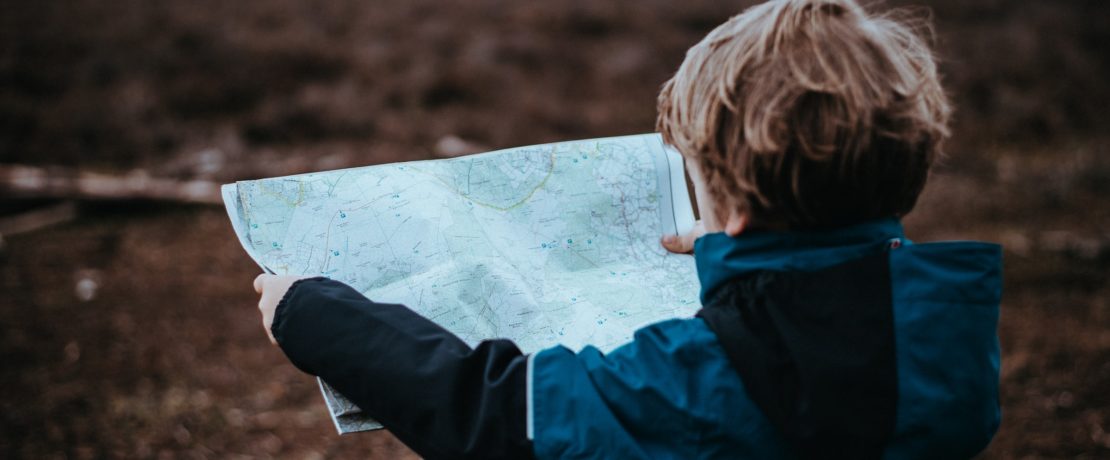 Young child studying a map